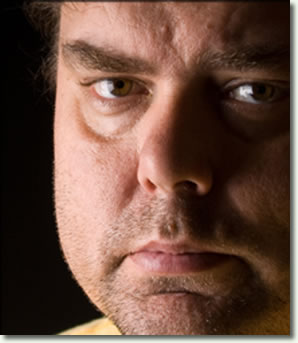 Close-up photo an angry appearing man