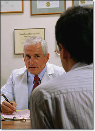 Photo of a health care worker at a discussing care with a patient.