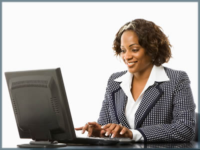 a business woman working at a computer