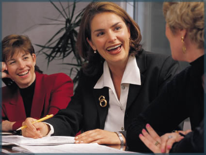 3 woman sitting in a meeting