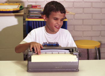 Boy using a TTY device