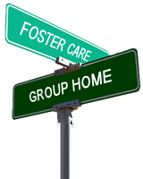 Two street signs indicating the intersection of foster care and group home.