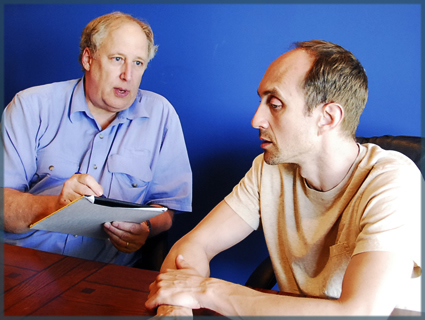 A Case manager talking to a client and taking notes