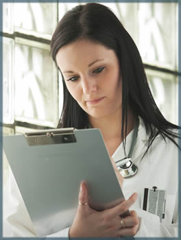 a Dr looking over a chart