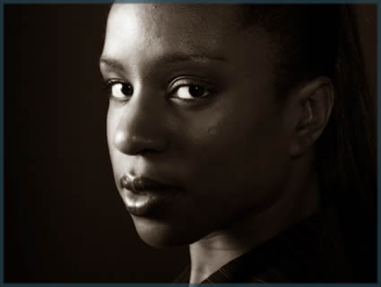 a close up of a young womans face