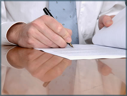 a business man signing papers