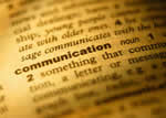 Dictionary open to the definition of communication