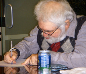 Man taking notes on a piece of paper.