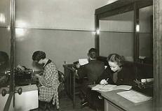 Office staff doing paperwork.